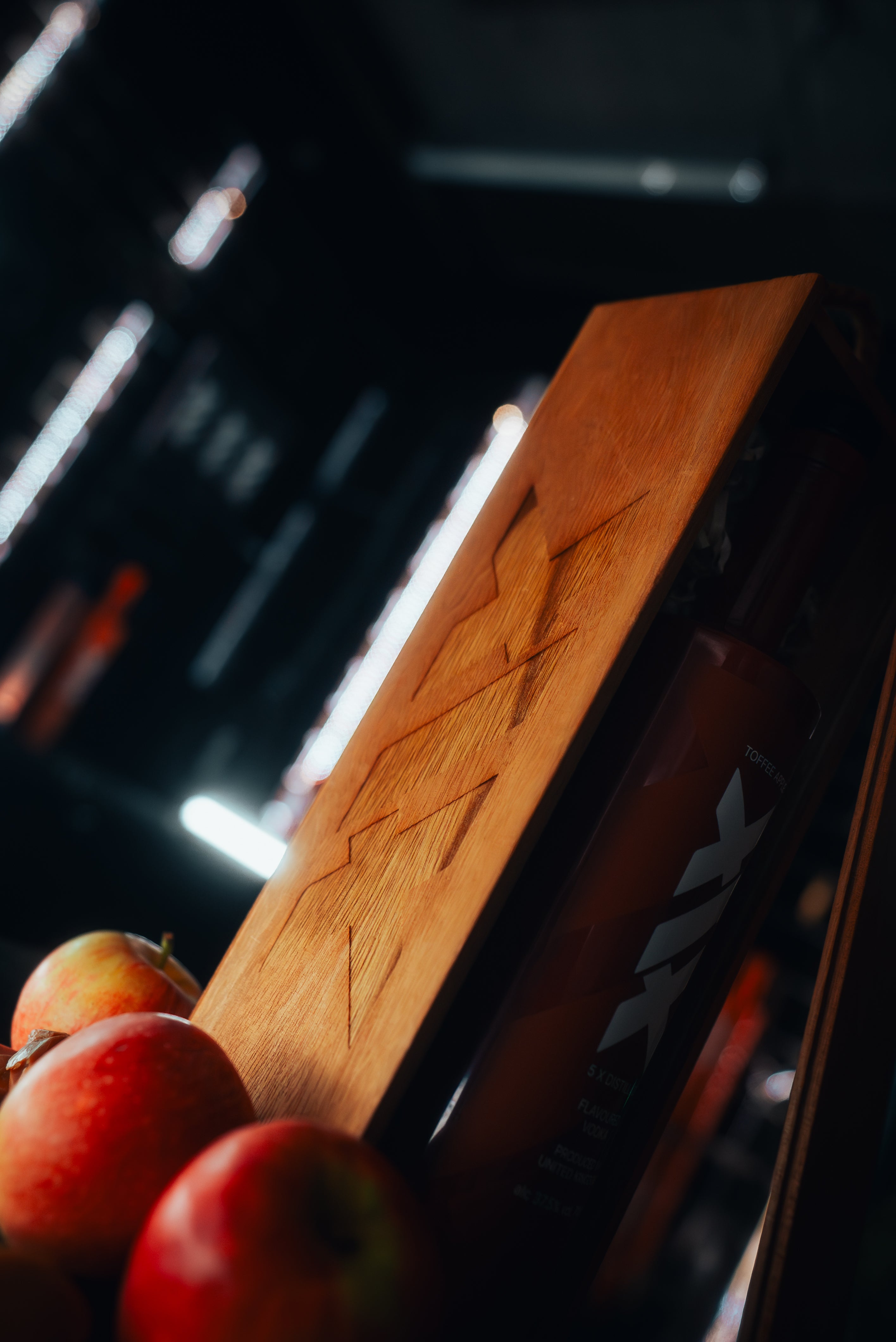 Wooden branded box with apples on a dark background